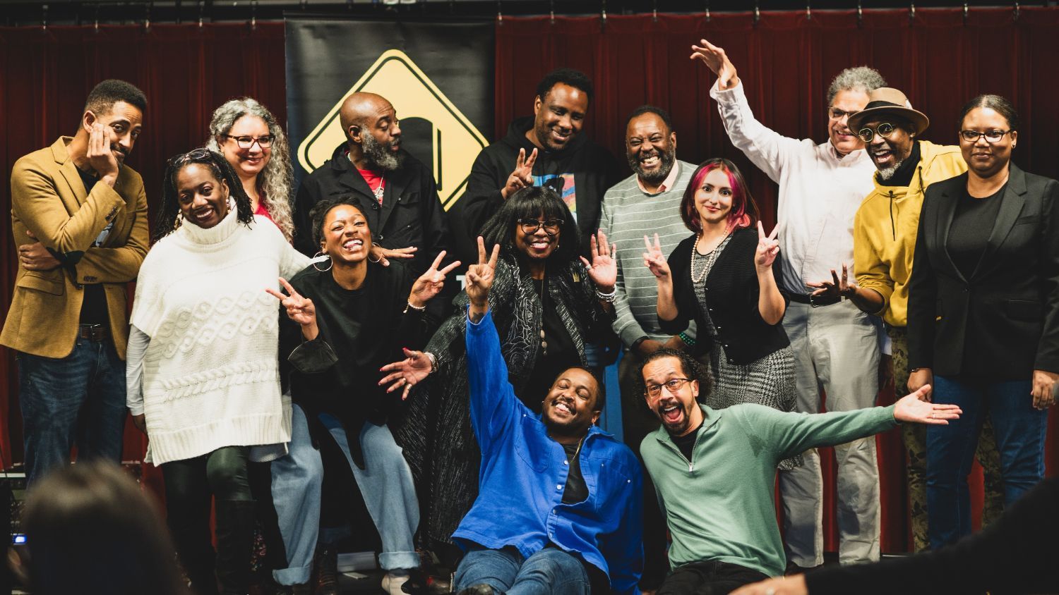 The poets and CityLit Project staff pose for a fun group photo.