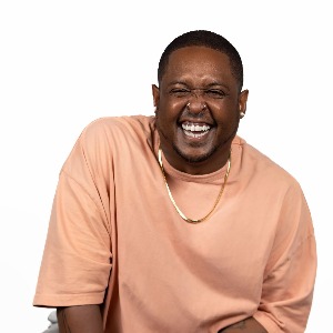 Danez Smith's headshot. They are smiling with joy.